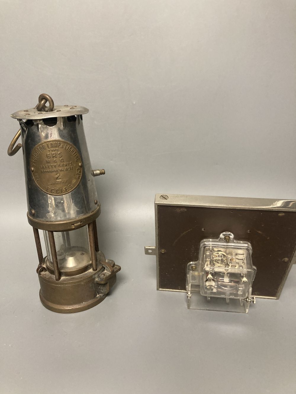 A 1930s Gents of Leicester mantel clock and a Miners lamp by Eccles, 24cm